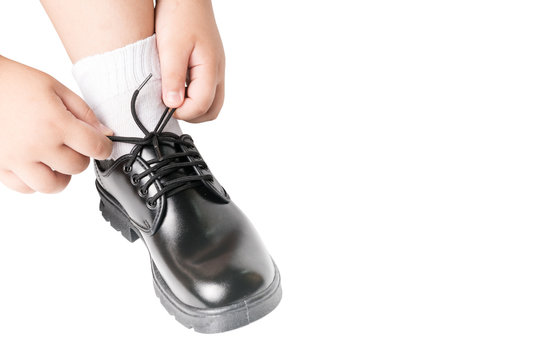 Thai Boy Is Tying The Laces Student Shoe