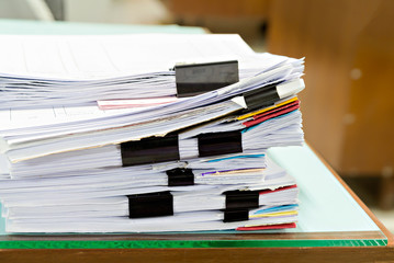 Close up of business documents stack on desk , report papers stack