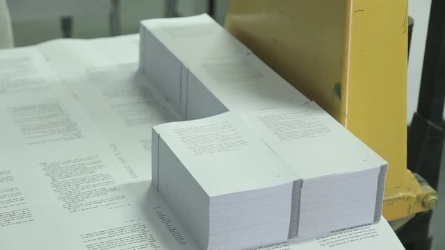 Pile of printed books before covering process