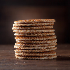 Waffles with caramel on wood