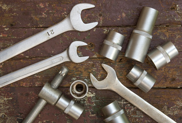 Fototapeta premium Set of instruments on wooden background. Wrenches and heads. 