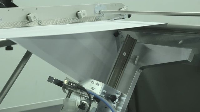 Printed books in an industrial digital printer.