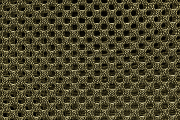 Abstract background texture of yellow gold fishnet cloth material. Yellow gold nylon texture for background and design with copy space for text or image.