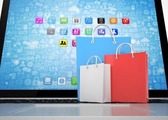 laptop and  shopping pags on white background. 3d rendering.