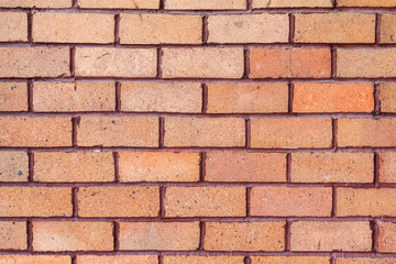 Obraz premium Orange brick wall. brick texture. brick pattern. Part of brick wall for background and design with copy space for text or image. 