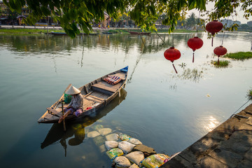 Vietnamese Woman on a wood boat