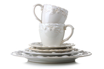cups and plates and saucers on a white isolated background