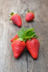 Strawberry. Fresh strawberry on a wooden background. 