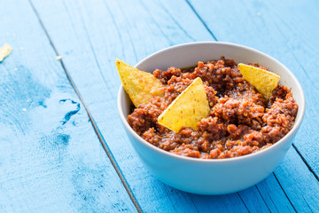 Tortilla Cips In Homemade Tomato Sauce (Ketchup) On Blue Wooden Table