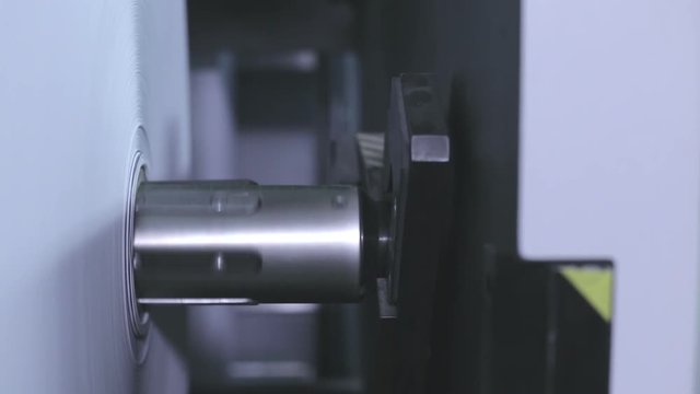 Slider Shot Of Paper Roll Rotate In Printer.