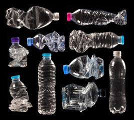 variety of compressed plastic bottles isolated on black background - obrazy, fototapety, plakaty