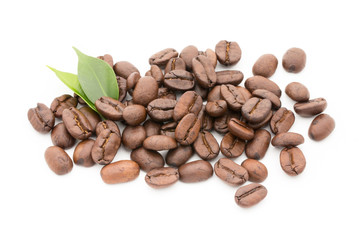 Coffee grains and leaves isolated on the white backgrounds.