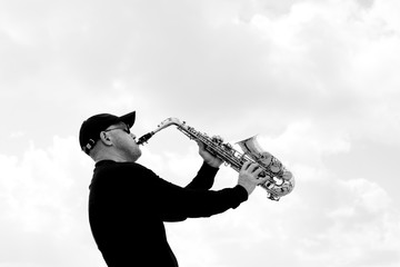 Saxophonist playing on saxophone outdoor