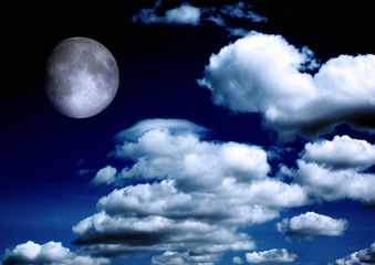 Fototapeta na wymiar The moon in the night sky in clouds