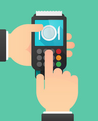 Person hands using a dataphone with  a dish, knife and a fork ic