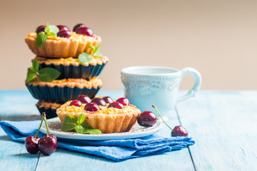 Small tarts with fresh cherries