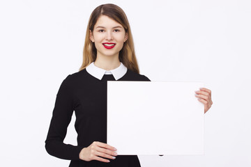 Fototapeta premium happy woman holding white blank paper