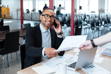 Bisnessman giving papers to someone