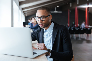 Young businessman working with laptop