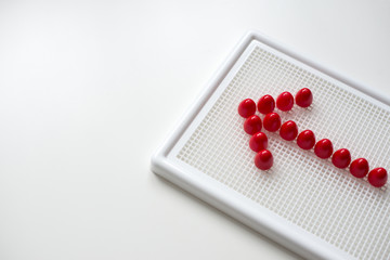 Children's developing game and red arrow on it. Red arrow isolat