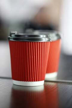 Take-out coffee in paper red cup