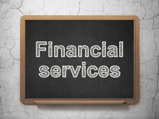 Money concept: Financial Services on chalkboard background