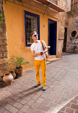male tourist walking in the old town