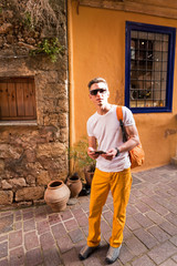 male tourist walking in the old town