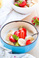 yougurt with strawberries, kiwi and banana.