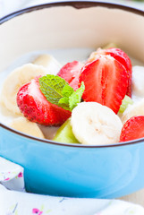 yougurt with strawberries, kiwi and banana.