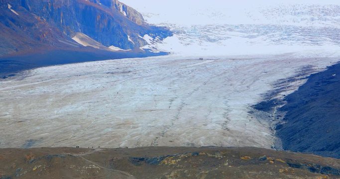 4K People Walking on Glacier Icefield, Extreme Zoom Shot