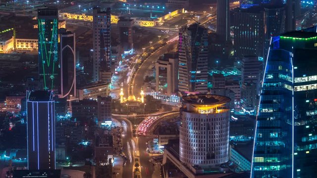 Skyline with Skyscrapers night timelapse in Kuwait City downtown illuminated at dusk. Kuwait City, Middle East