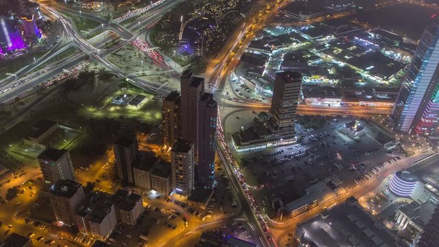 Skyline with Skyscrapers night timelapse in Kuwait City downtown illuminated at dusk. Kuwait City, Middle East