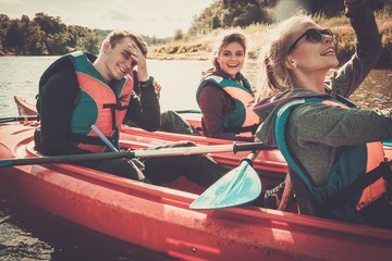 Happy best friends having fun on a kayaks © Nejron Photo