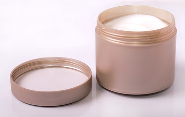 a jar with male hair styling cream