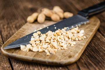 Some chopped Peanuts (close-up shot; selective focus)