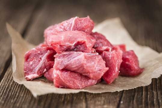 Beef Fillet (chopped) on wooden background