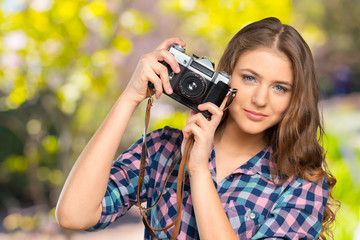Young Woman Holding Camera