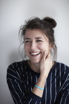 Portrait of smiling young woman, studio shot
