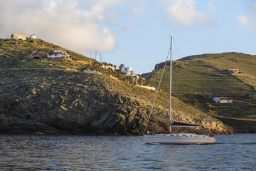 Yacht with a deflated sails near the Greek coast.