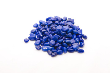 Decorative blue stones on white background