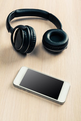 headphones on wooden background