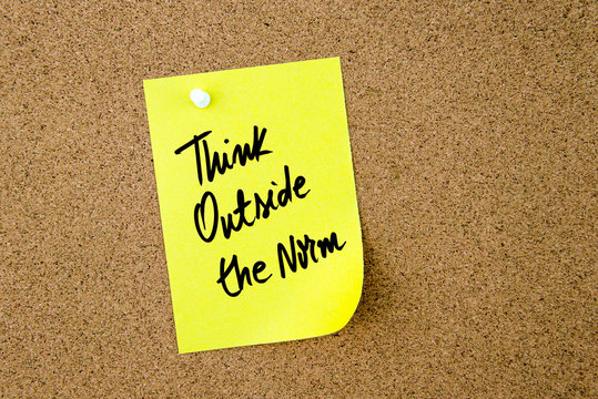 Think Outside The Norm Written On Yellow Paper Note