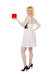 smiling young woman posing with a present box.