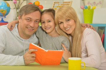 happy family reading the book