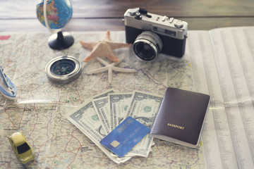 Fototapeta na wymiar compass, passport, credit card, banknote, globe, camera, map, sh
