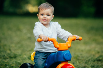 Small kid ride a bicycle outdoors