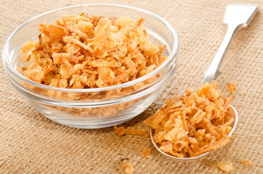crispy onion in a glass bowl and spoon