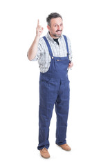 Full body of handsome repairman pointing finger up