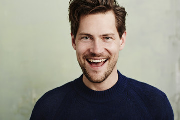 Happy stubble guy in blue, portrait